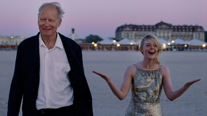 Stellan Skarsgård (trái) và Elle Fanning trong Sentimental Value. Ảnh: Mubi